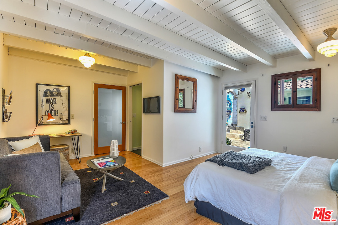 1102 Grant Avenue Venice, CA 90291 - Photo 24 of 29 a bedroom with a bed and wooden floor