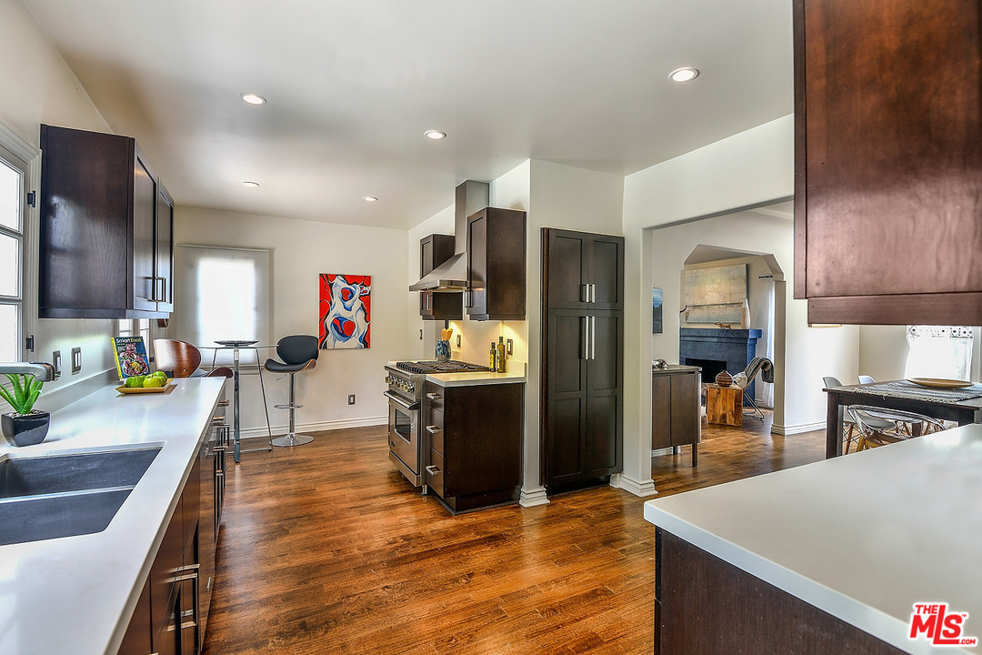 1102 Grant Avenue Venice, CA 90291 - Photo 9 of 29 a large kitchen with stainless steel appliances kitchen island granite countertop a large counter top cabinets and stainless steel appliances