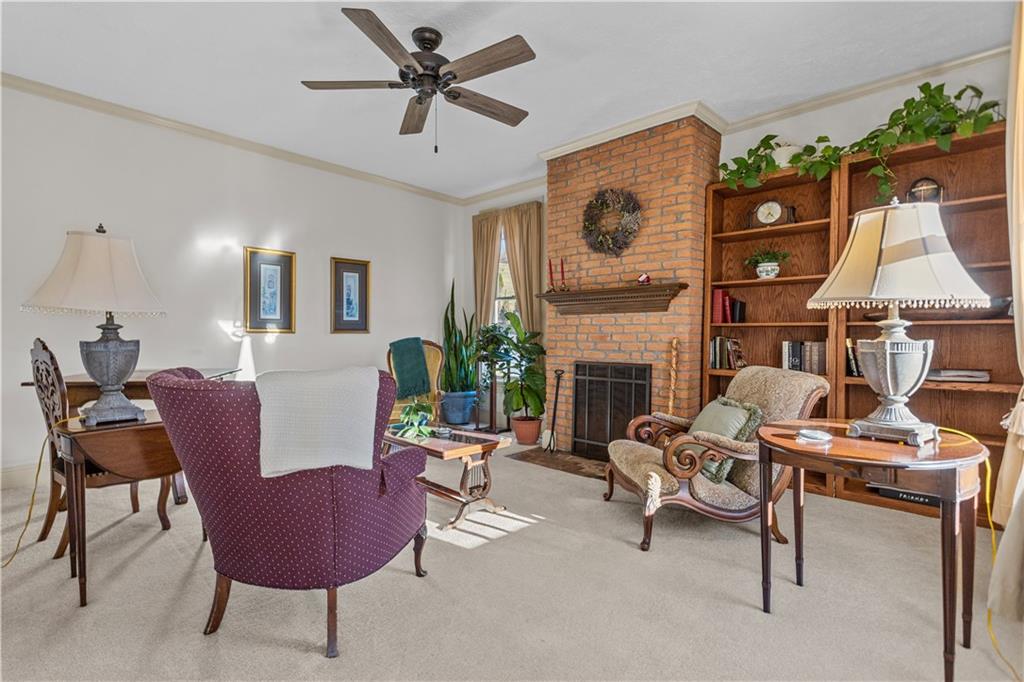 300 McCombs Road Venetia, PA 15367 - Photo 15 of 25 a living room with furniture a fireplace and a flat screen tv