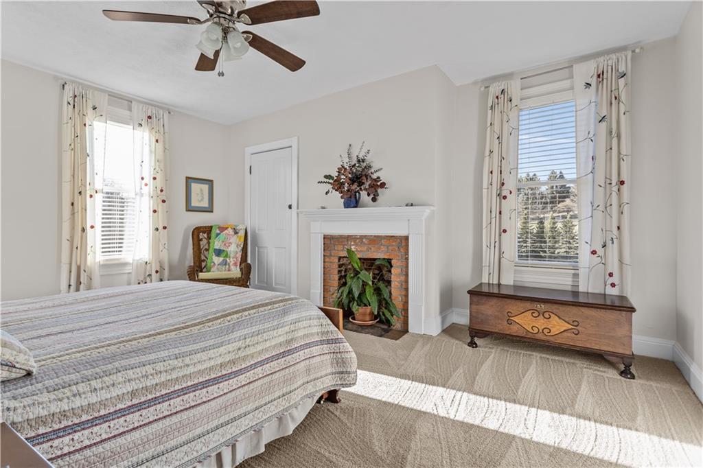 300 McCombs Road Venetia, PA 15367 - Photo 18 of 25 a bedroom with a bed and a fireplace