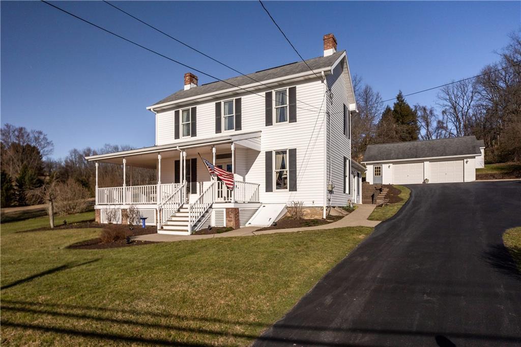 300 McCombs Road Venetia, PA 15367 - Photo 2 of 25 a front view of a house with garden
