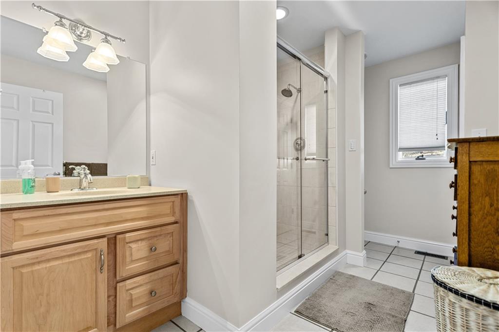 300 McCombs Road Venetia, PA 15367 - Photo 23 of 25 a bathroom with a shower sink and mirror