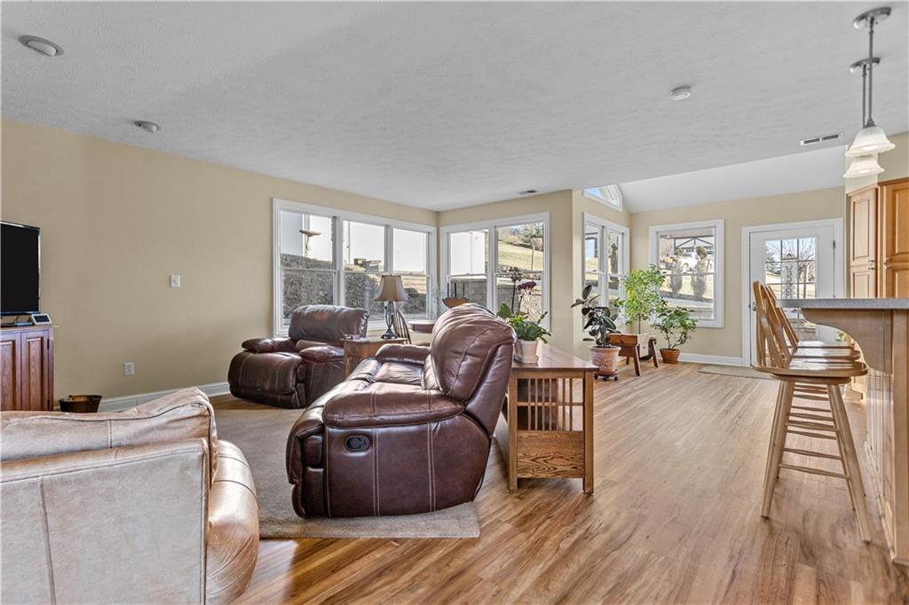 300 McCombs Road Venetia, PA 15367 - Photo 9 of 25 a living room with furniture a flat screen tv and a floor to ceiling window