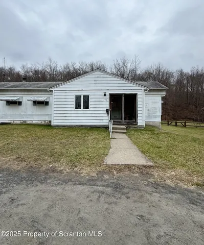 a bed room with a bed and a window