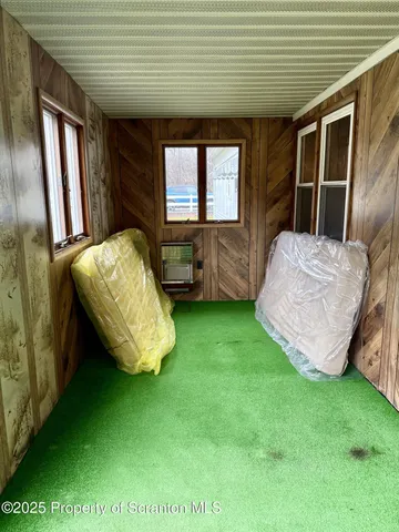 a bathroom with a glass shower door