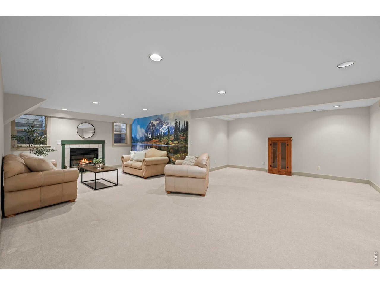 4824 Briar Ridge Court Boulder, CO 80301 - Photo 25 of 40 a living room with furniture and a fireplace