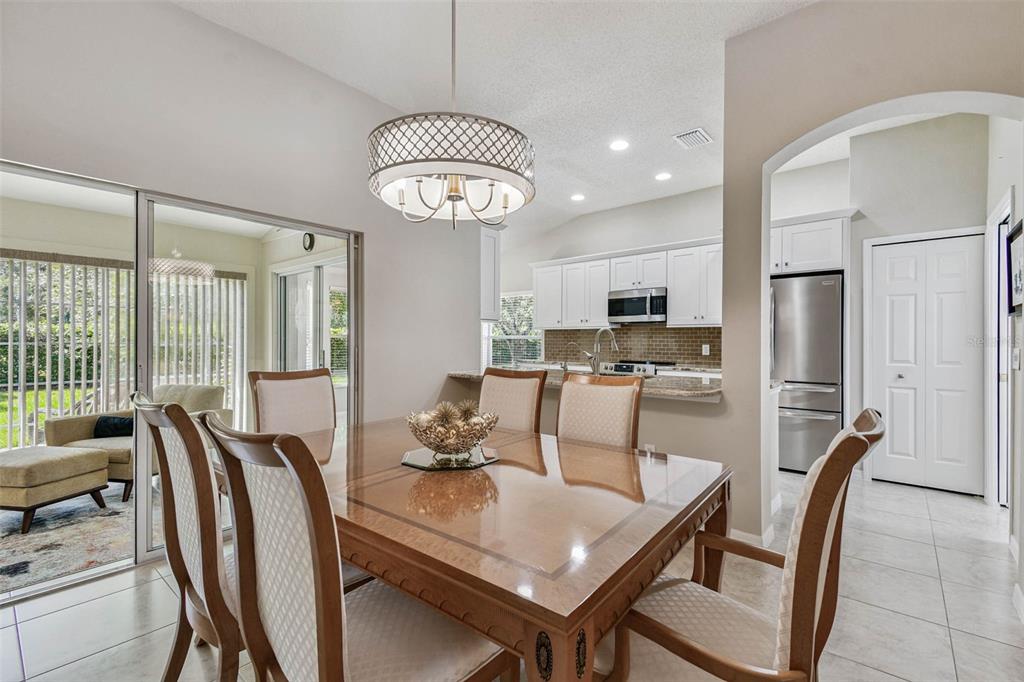 12202 Aaron Terrace Trinity, FL 34655 - Photo 12 of 41 a view of kitchen with dining table and chairs