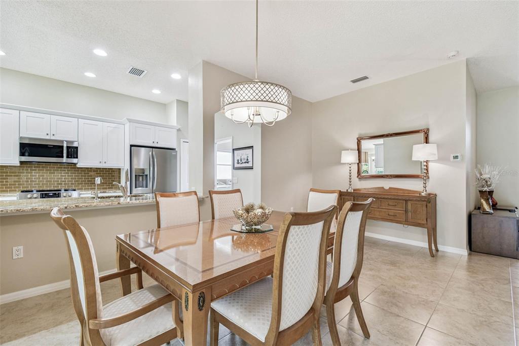 12202 Aaron Terrace Trinity, FL 34655 - Photo 19 of 41 a dining room with furniture and window