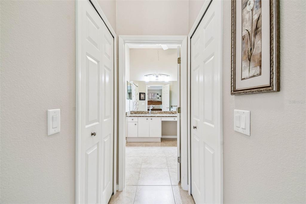 12202 Aaron Terrace Trinity, FL 34655 - Photo 22 of 41 a bathroom with a glass door shower and a sink