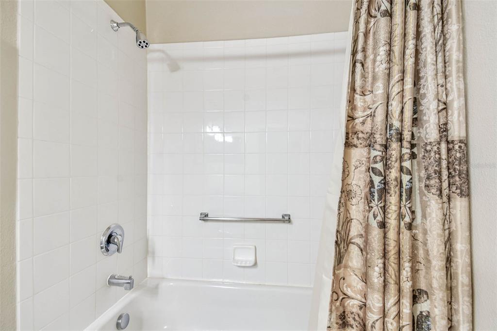 12202 Aaron Terrace Trinity, FL 34655 - Photo 29 of 41 a bathroom with a bathtub and a shower