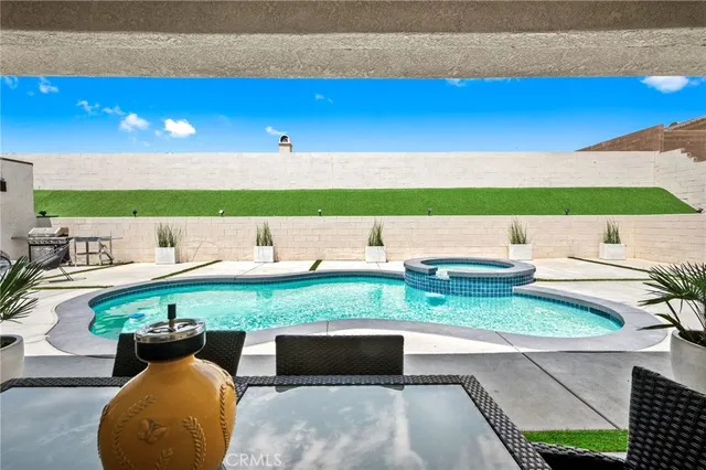 a view of outdoor space with seating area and green space