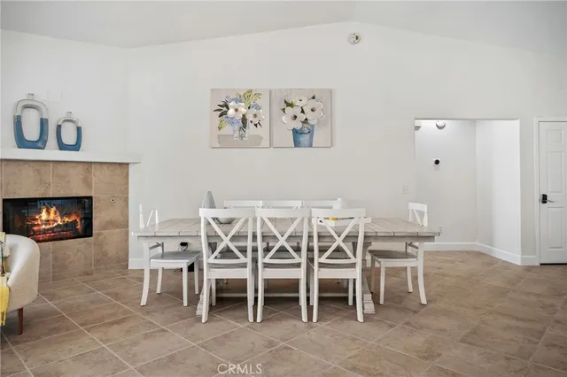 a dining room with furniture and a fireplace