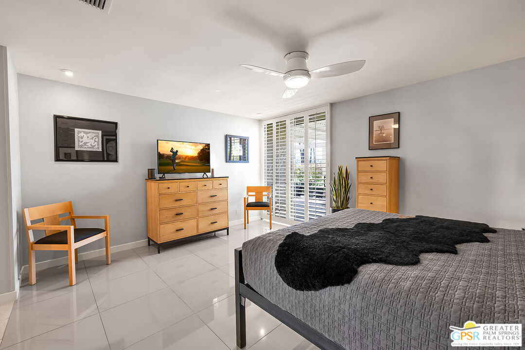 72355 Rodeo Way Rancho Mirage, CA 92270 - Photo 19 of 43 a bedroom with a bed and a television