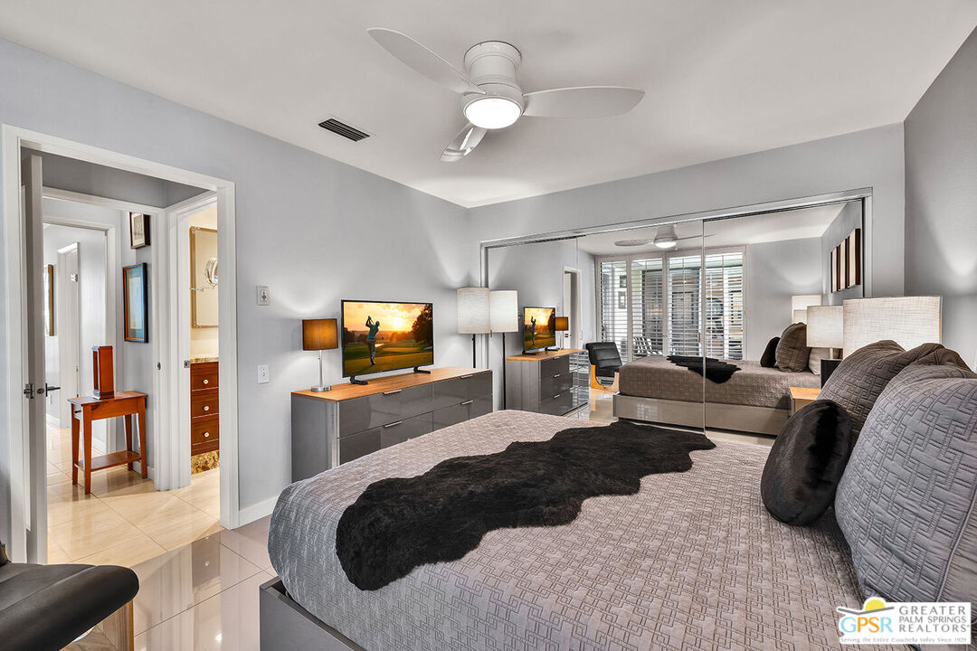 72355 Rodeo Way Rancho Mirage, CA 92270 - Photo 24 of 43 a living room with furniture and a flat screen tv