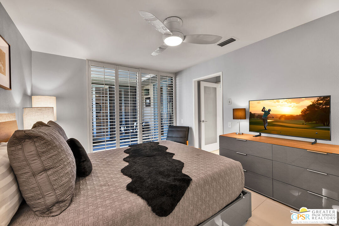 72355 Rodeo Way Rancho Mirage, CA 92270 - Photo 26 of 43 a bedroom with a large bed and a flat screen tv