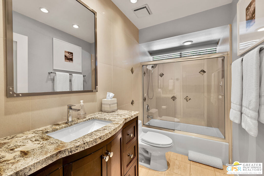 72355 Rodeo Way Rancho Mirage, CA 92270 - Photo 27 of 43 a bathroom with a granite countertop sink toilet and shower