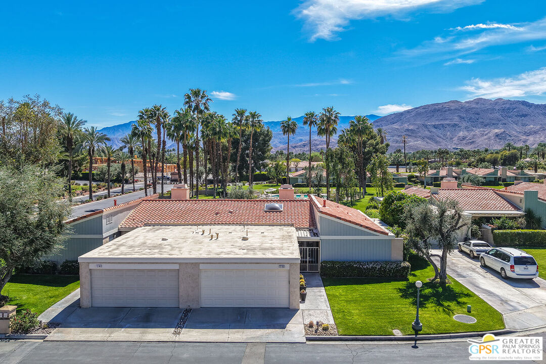 72355 Rodeo Way Rancho Mirage, CA 92270 - Photo 33 of 43 a view of a swimming pool with an outdoor space and seating area