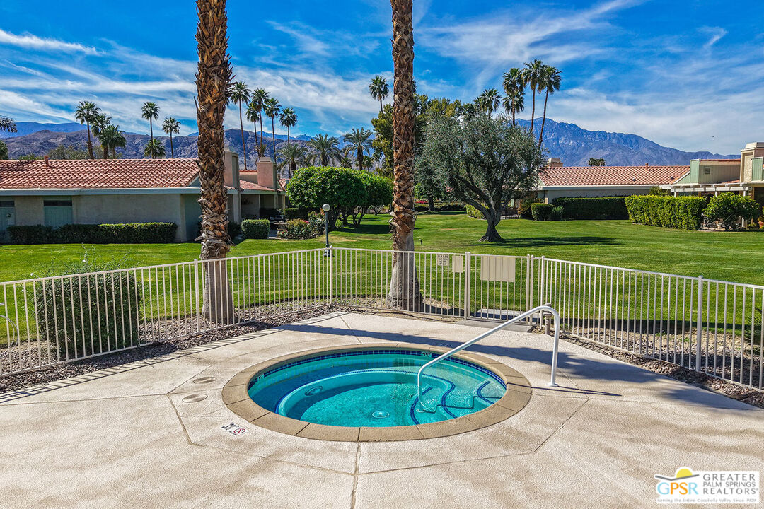 72355 Rodeo Way Rancho Mirage, CA 92270 - Photo 35 of 43 a view of a garden with a house in the background
