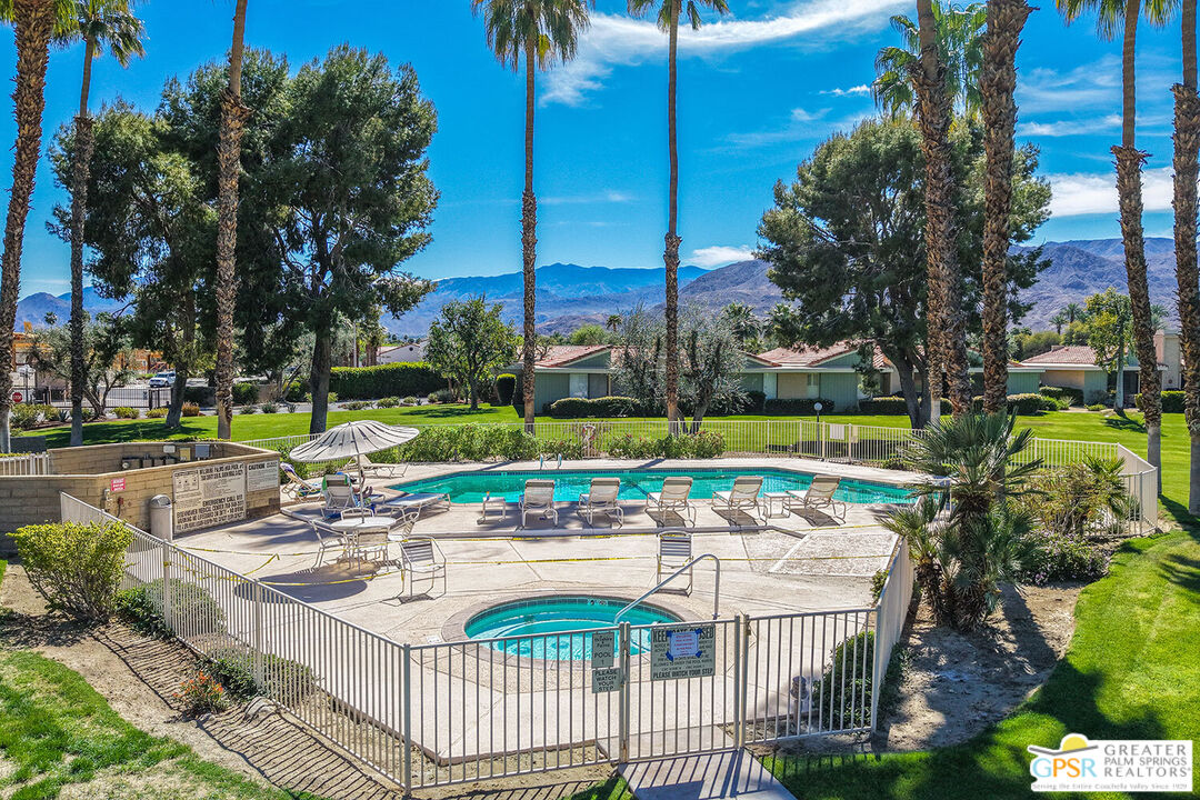 72355 Rodeo Way Rancho Mirage, CA 92270 - Photo 36 of 43 a view of a swimming pool with a patio and a yard