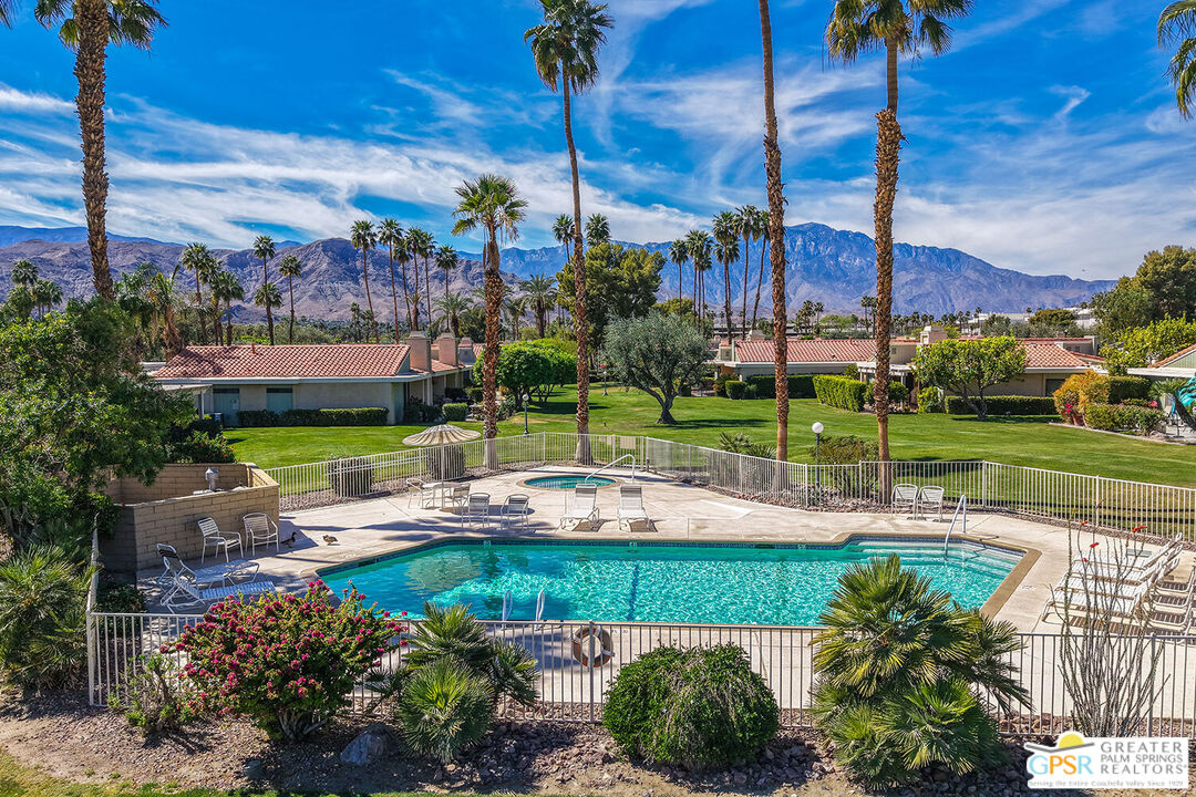 72355 Rodeo Way Rancho Mirage, CA 92270 - Photo 37 of 43 a view of a garden with a table chairs and a fire pit