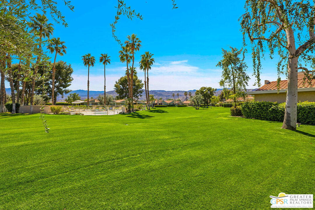 72355 Rodeo Way Rancho Mirage, CA 92270 - Photo 38 of 43 a front view of a house with a garden
