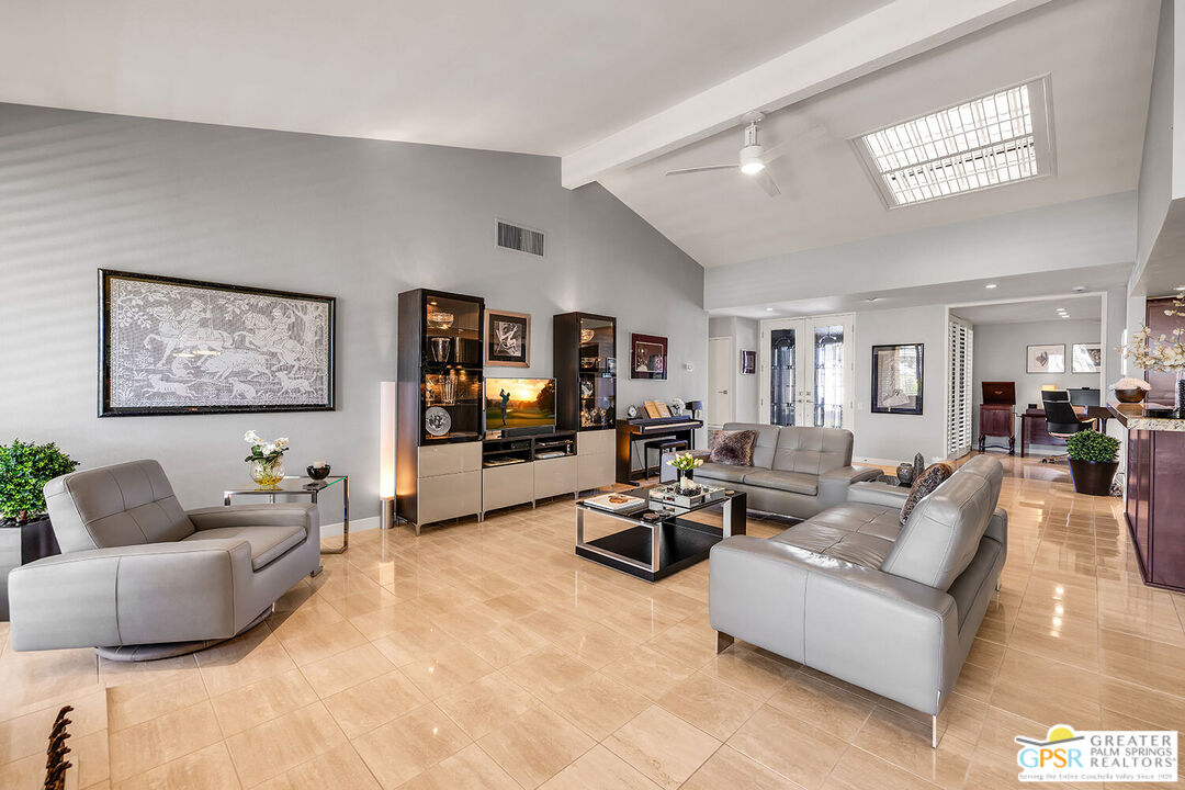 72355 Rodeo Way Rancho Mirage, CA 92270 - Photo 4 of 43 a living room with furniture and a flat screen tv