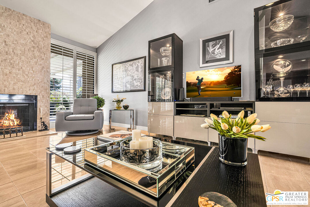 72355 Rodeo Way Rancho Mirage, CA 92270 - Photo 6 of 43 a living room with furniture and a flat screen tv