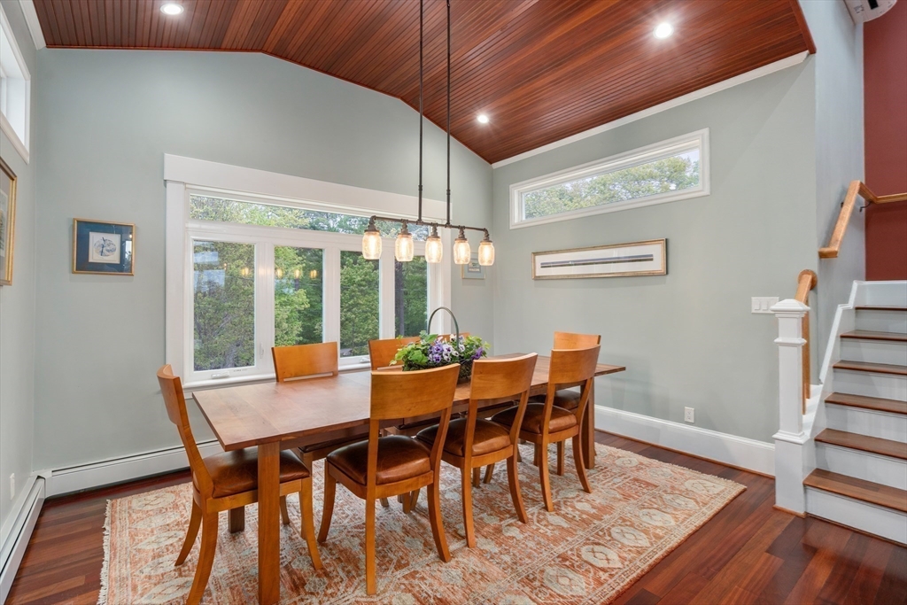 602 Summer Street Manchester, MA 01944 - Photo 16 of 34 a view of a dining room with furniture wooden floor and chandelier