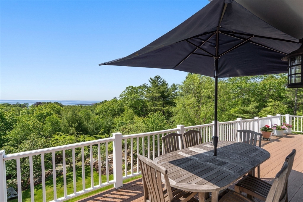 602 Summer Street Manchester, MA 01944 - Photo 33 of 34 a view of a chair and table on the deck