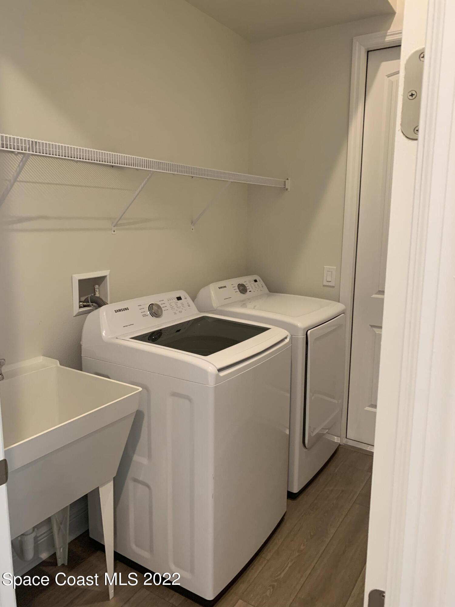 1893 Killian Drive Palm Bay, FL 32905 - Photo 20 of 25 a utility room with dryer and washer
