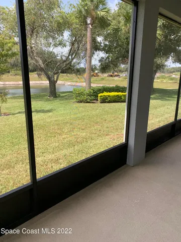a view of an empty room with a large window