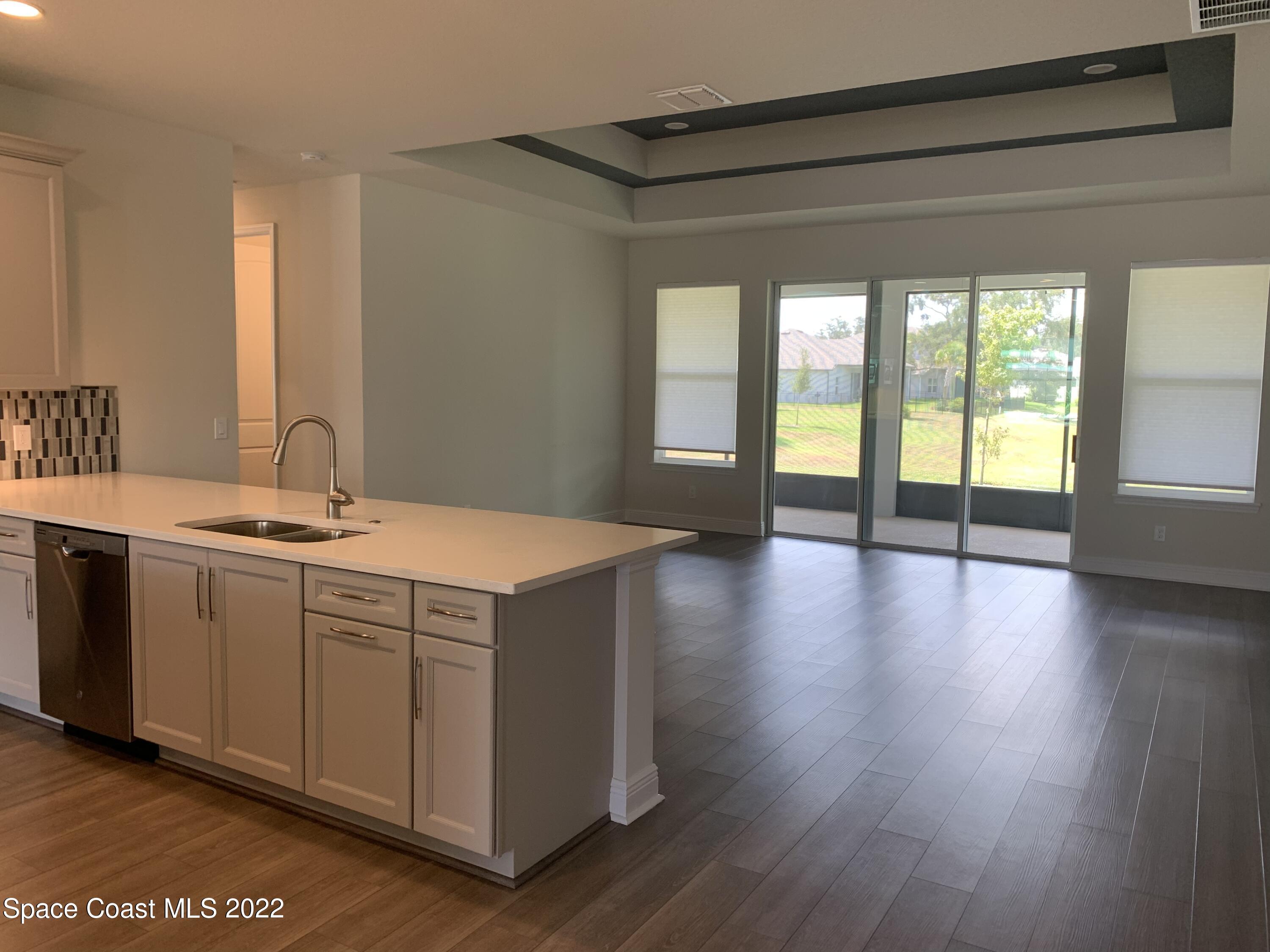 1893 Killian Drive Palm Bay, FL 32905 - Photo 10 of 25 a bathroom with a double vanity sink and a large mirror