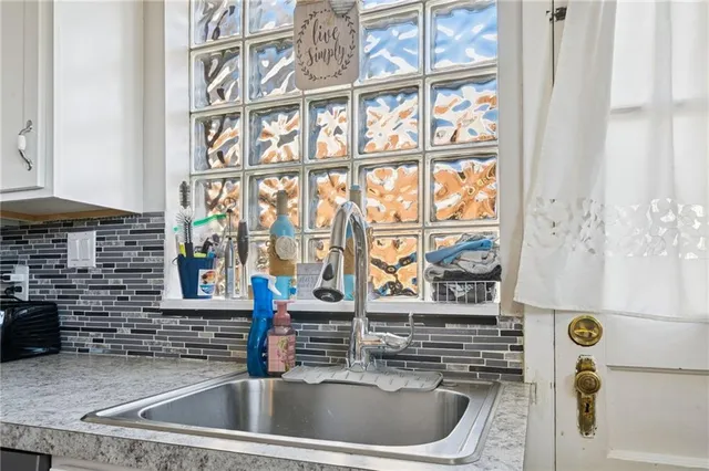 a kitchen with a sink and a window
