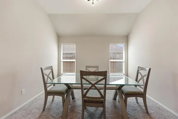 a view of a workspace with furniture and wooden floor
