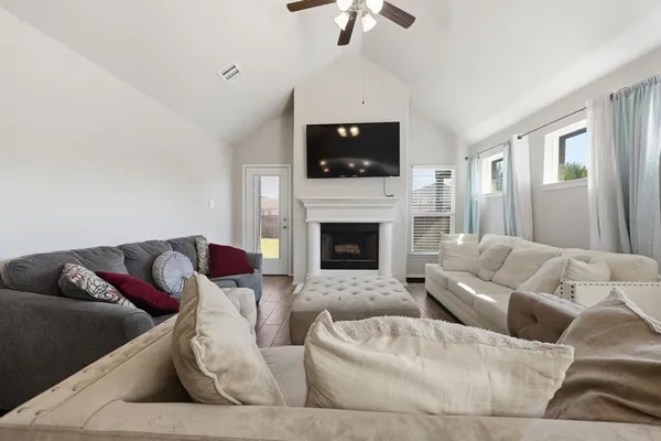 a living room with furniture and a flat screen tv