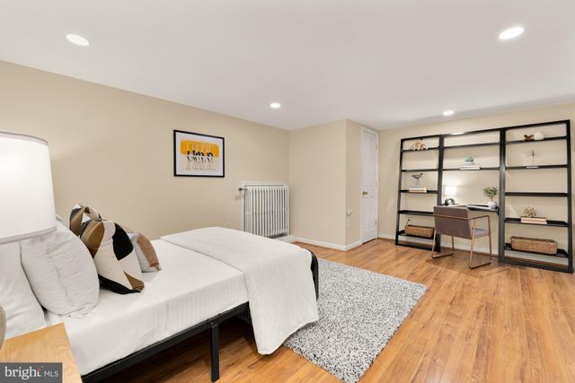 a bedroom with a bed and a table in it