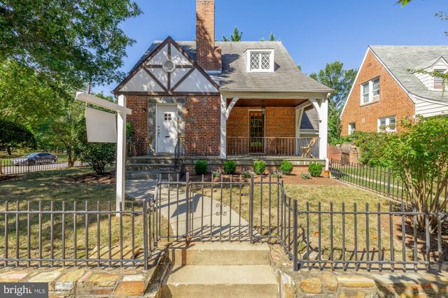 a view of a house with swimming pool and sitting area