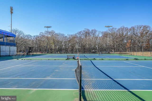 a front view of a building with parking space