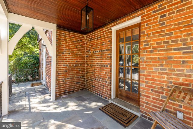a view of a door and wooden floor