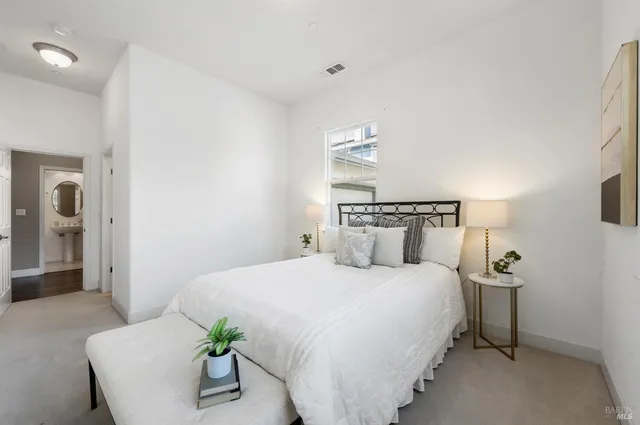 a view of a living room and kitchen