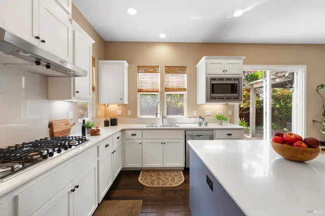 a view of a dining room with furniture and a fireplace
