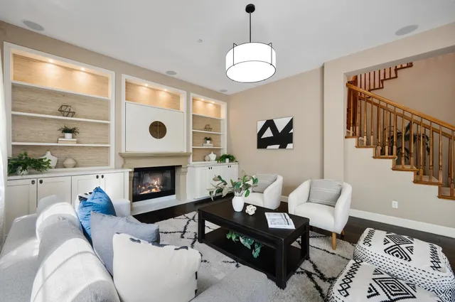 a bed sitting in a bedroom next to a potted plant