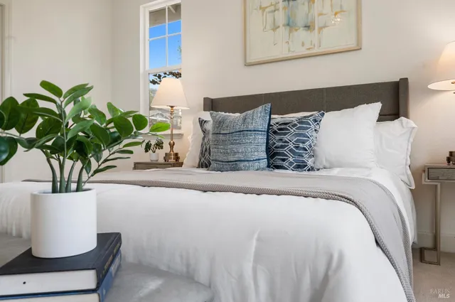 a large bathroom with a double vanity sink large mirror and a bathtub