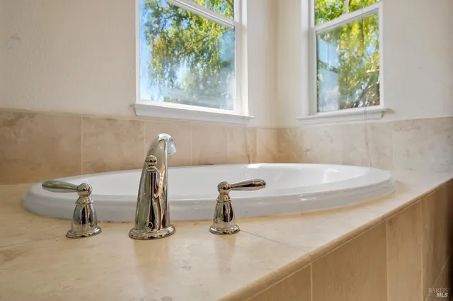 a bathroom with a sink a vanity and mirror