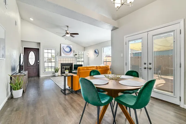 a view of a dining room with furniture window and wooden floor