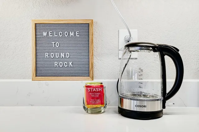 a room with a bench and a mirror