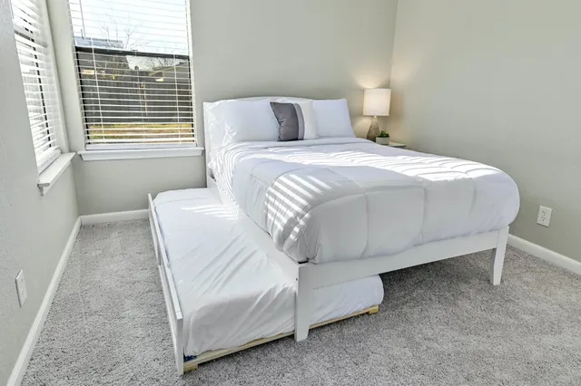 a bathroom with a sink toilet vanity and bathtub