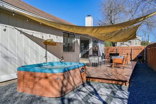 a patio with table and chairs