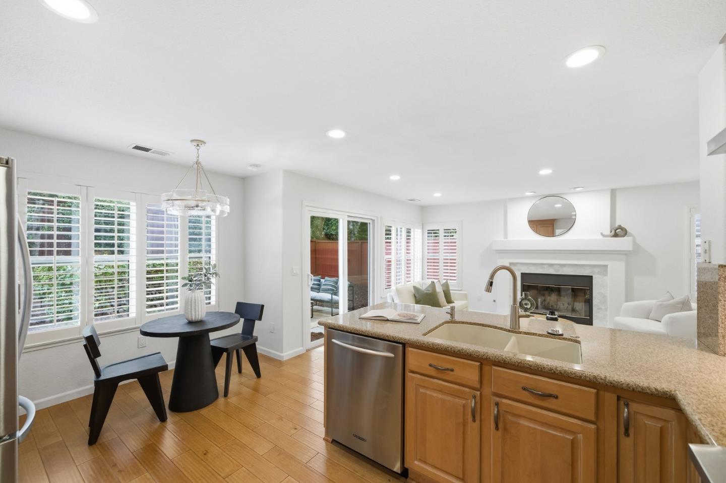 375 Montevideo Circle Fremont, CA 94539 - Photo 11 of 45 a kitchen with a sink dining table and chairs