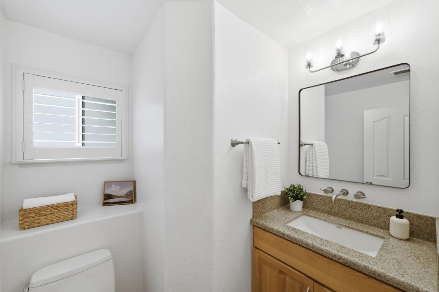 375 Montevideo Circle Fremont, CA 94539 - Photo 20 of 45 a bathroom with a granite countertop sink and a mirror